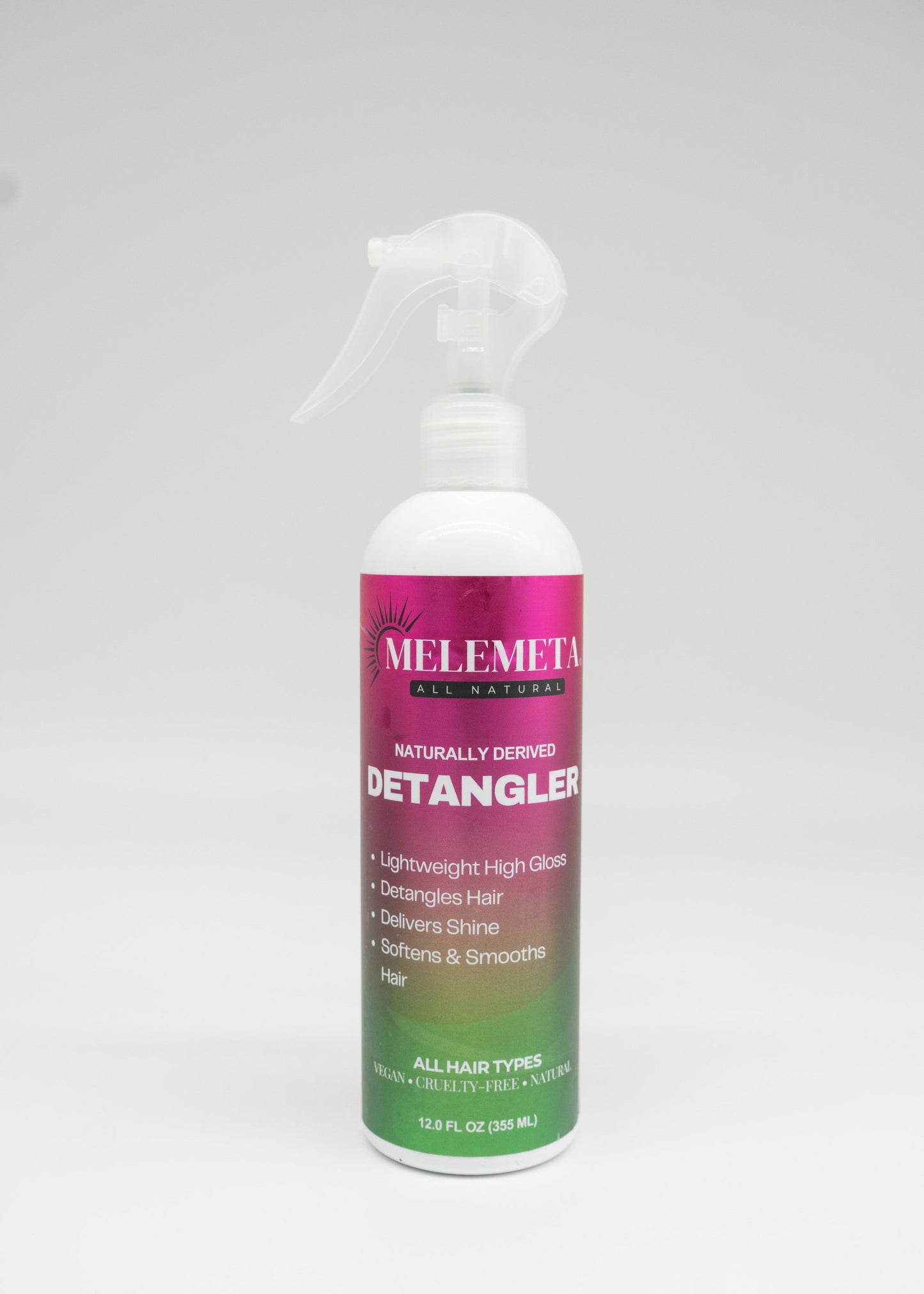 Melemeta Detangler spray bottle on a white background