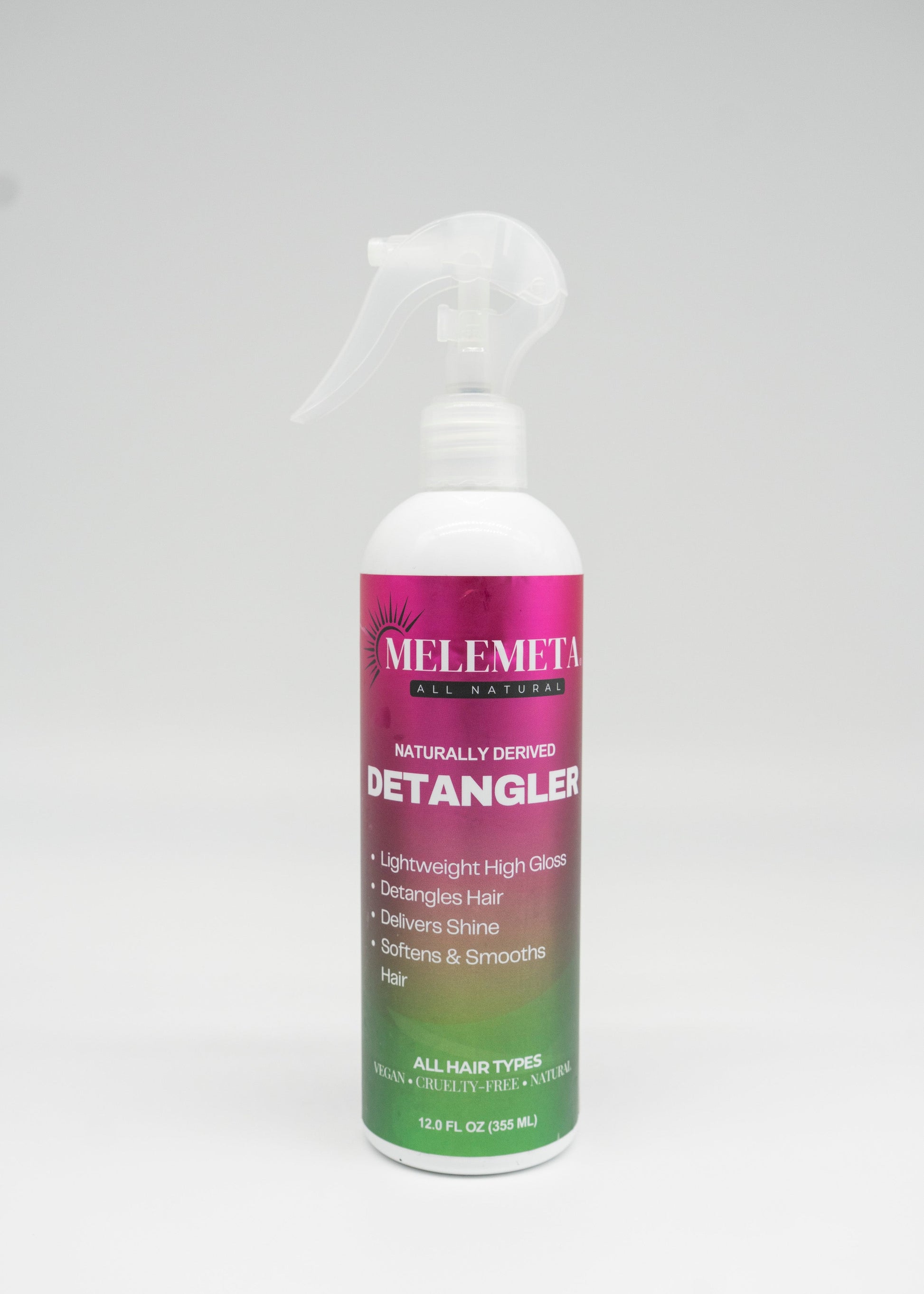 Melemeta Detangler spray bottle on a white background